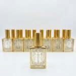 زجاجات عطور فارغة فاخرة مزخرفة بنقوش ذهبية إسلامية مع بخاخ مذهب (طقم 12 قطعة)
